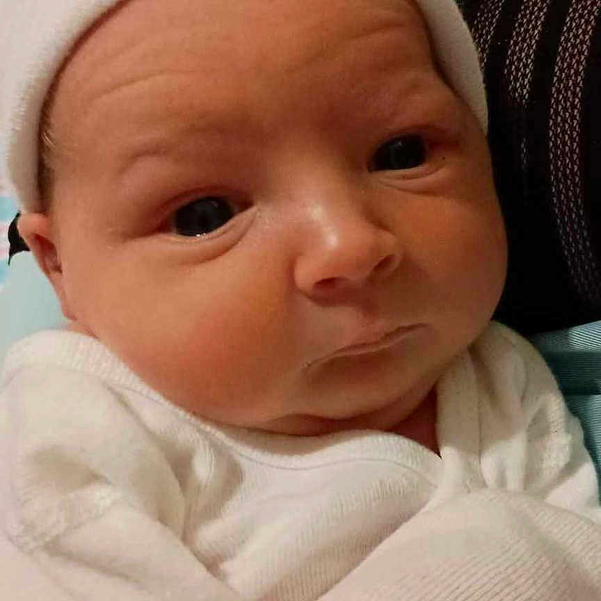 Oliver joined the competition — help win amazing prizes! architecture, baby, bed, blanket, bonnet, building, cap, clothing, face, furniture, happy, hat, head, hospital, newborn, person, photography, portrait, quilt, smile