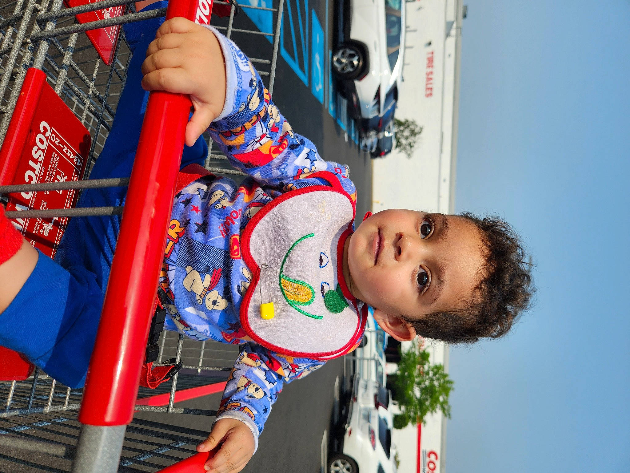 Christian is registered to the contest to win money with this photo: amusement_park, amusement_ride, blue, child, city, electric_blue, fun, happy, human_leg, leisure, pattern, person, play, playground, recreation, red, sky, smile, thigh, toddler