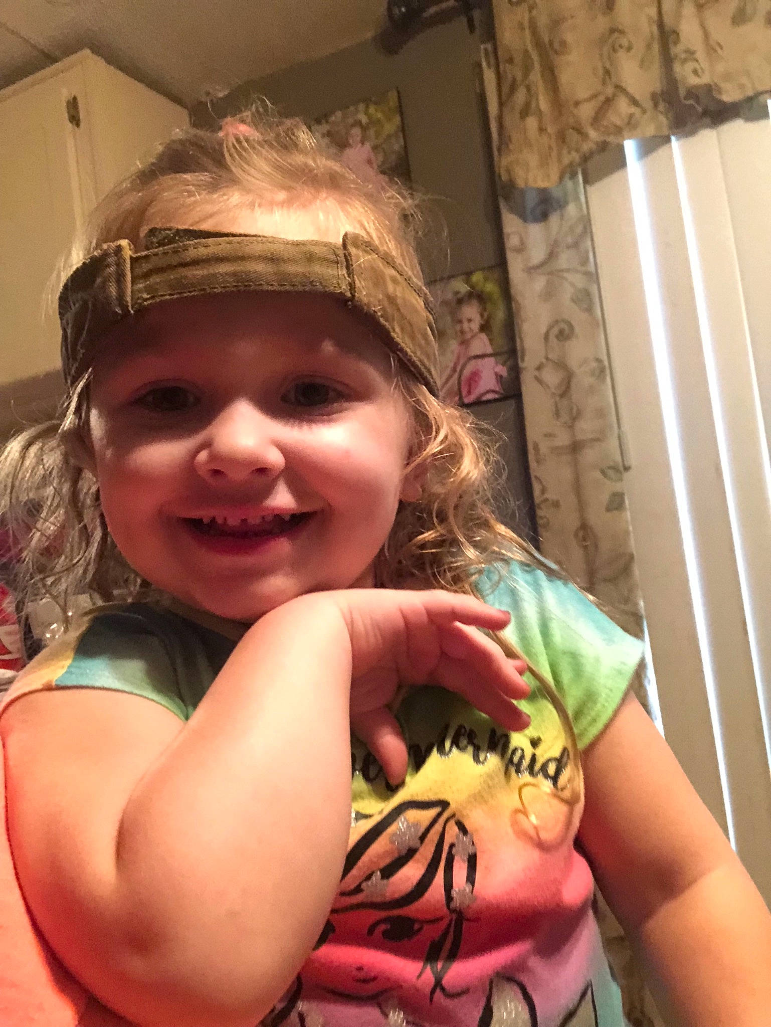 Lizzie is registered to the contest to win money with this photo: child, fun, headwear, joy, person, smile, toddler