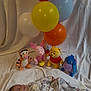 baby, balloons, blanket, celebration, child, cute, eeyore, happy, indoors, infant, lying_down, onesie, piglet, plush_toys, pooh, smile, soft, tigger, toy, winnie_the_pooh