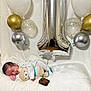 Gerald joined the competition — help win amazing prizes! baby, sleeping, teddy_bear, balloons, number_one, brownie, candle, white_blanket, celebration, birthday, soft_texture, cute, infant, party, decorations, silver_balloon, gold_balloon, polka_dot_balloon, striped_clothing, smiling