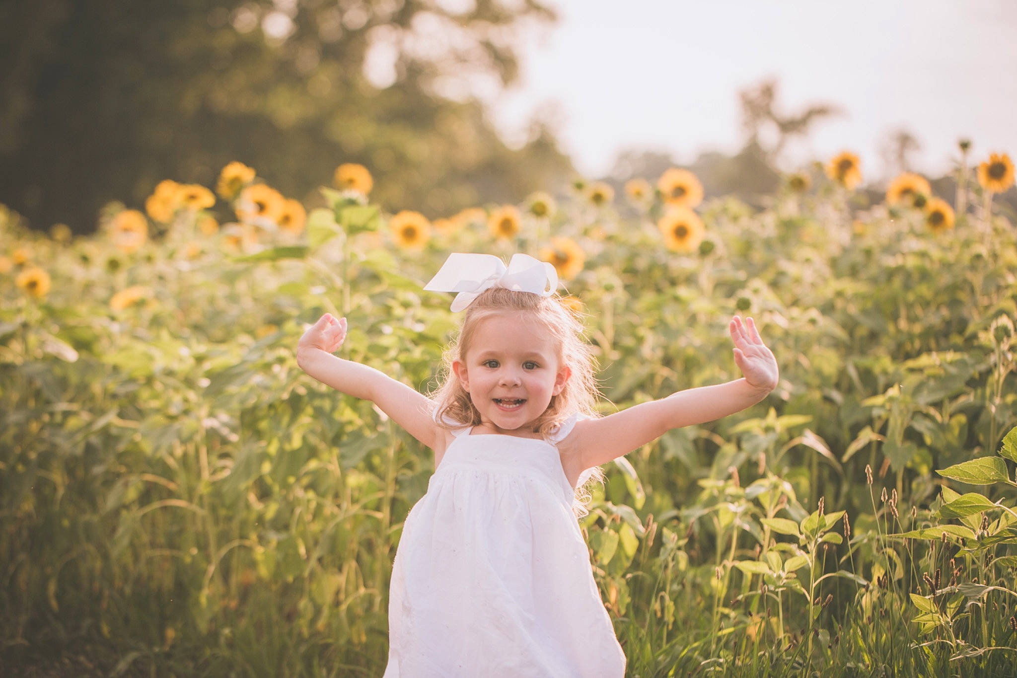 Harlowe joined the competition — help win amazing prizes! backlighting, child, facial_expression, field, fun, grass, grass_family, happy, joy, meadow, people, people_in_nature, person, photograph, photography, portrait, portrait_photography, sky, smile, sunlight