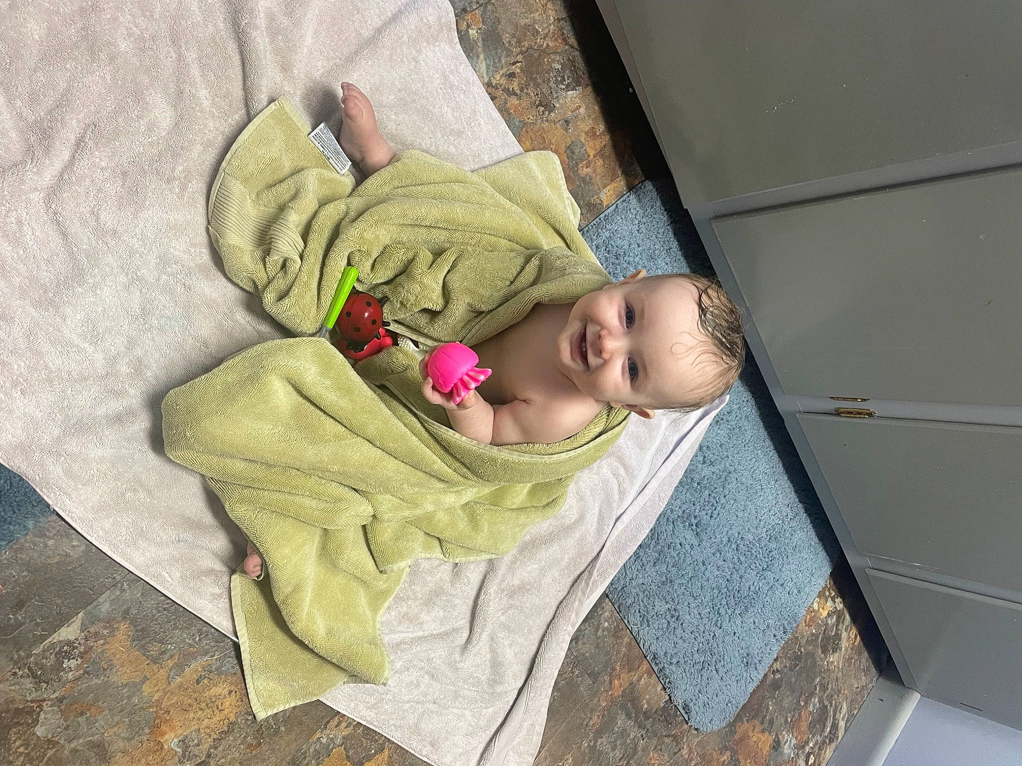 Levi is registered to the contest to win money with this photo: baby, baby_products, baby_safety, baby_sleeping, baby_toddler_clothing, bedding, child, comfort, face, floor, flooring, flower, head, headgear, joy, linens, nap, person, room, sleeve