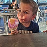 Mason joined the competition — help win amazing prizes! child, boy, toddler, ice_cream, cone, dessert, eating, food, portrait, close_up, face, eyes, brown_hair, smiling, cafe, restaurant, indoor, window, chairs, table