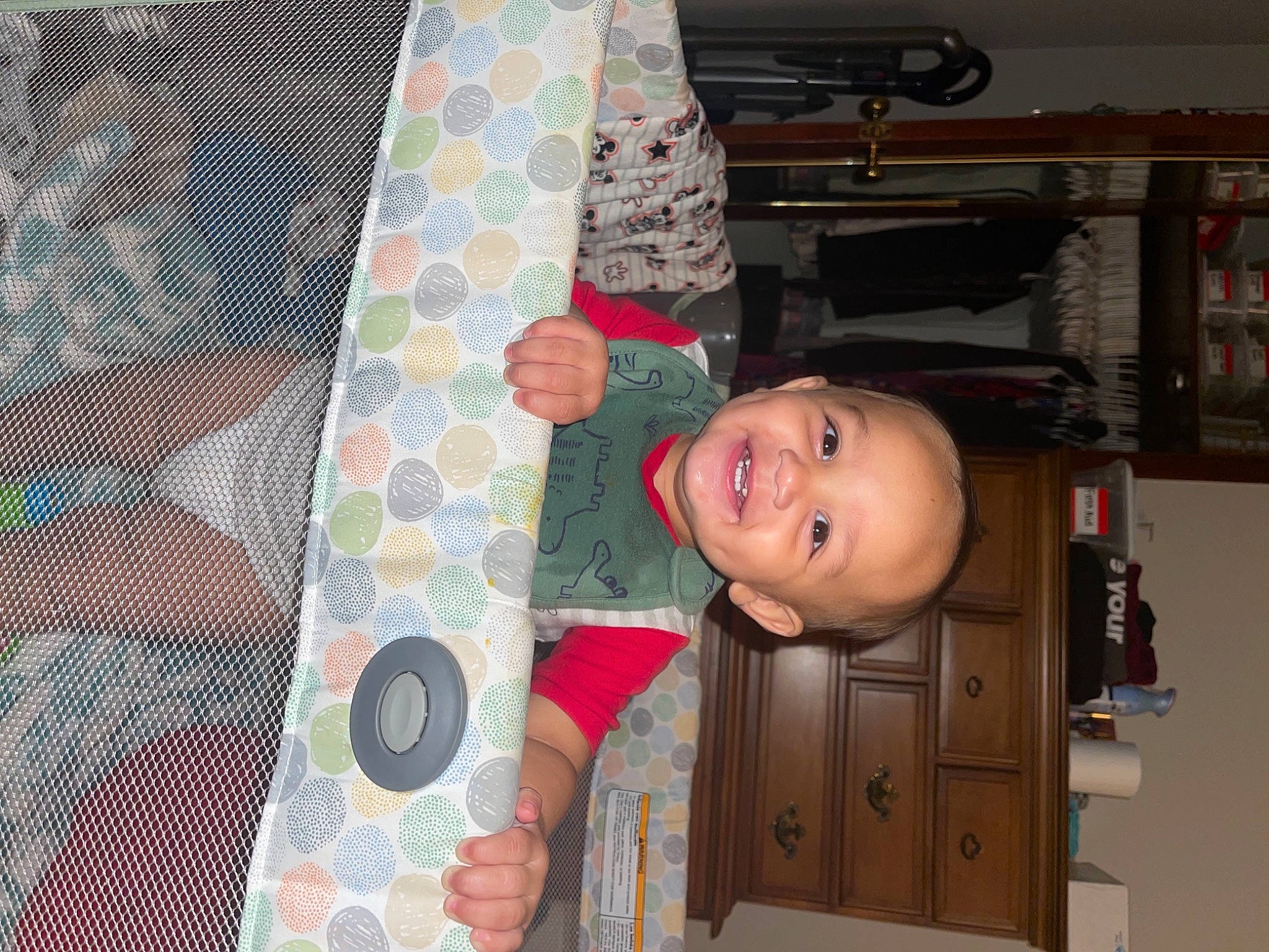 Carter is registered to the contest to win money with this photo: ceiling, child, circle, hardwood, home_door, joy, linens, machine, pattern, person, room, shelf, smile, tie, tints_and_shades, toddler, visual_arts, wood