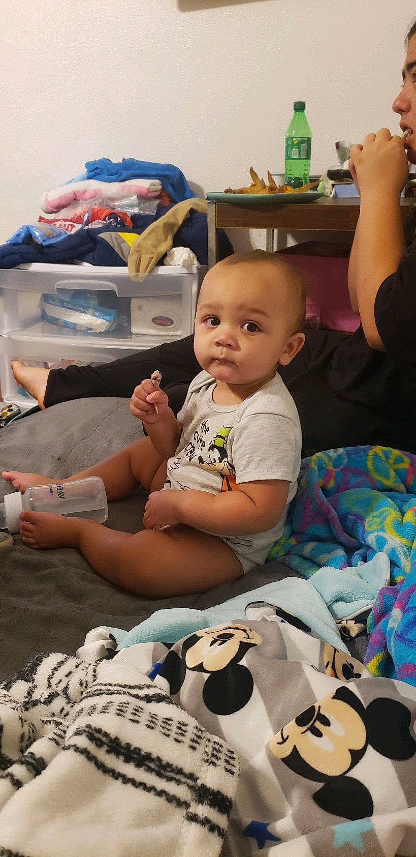 Carter is registered to the contest to win money with this photo: arm, baby, baby_toddler_clothing, bottle, chair, child, comfort, event, fun, happy, leisure, linens, pattern, person, play, room, sitting, t_shirt, textile, toddler