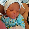 Jaliyah is registered to the contest to win money with this photo: arms, baby, bee_pattern, blanket, blue_onesie, child, closeup, cozy, cute, floral_pattern, headband, indoor, infant, mittens, newborn, peaceful, person, portrait, sleeping, soft
