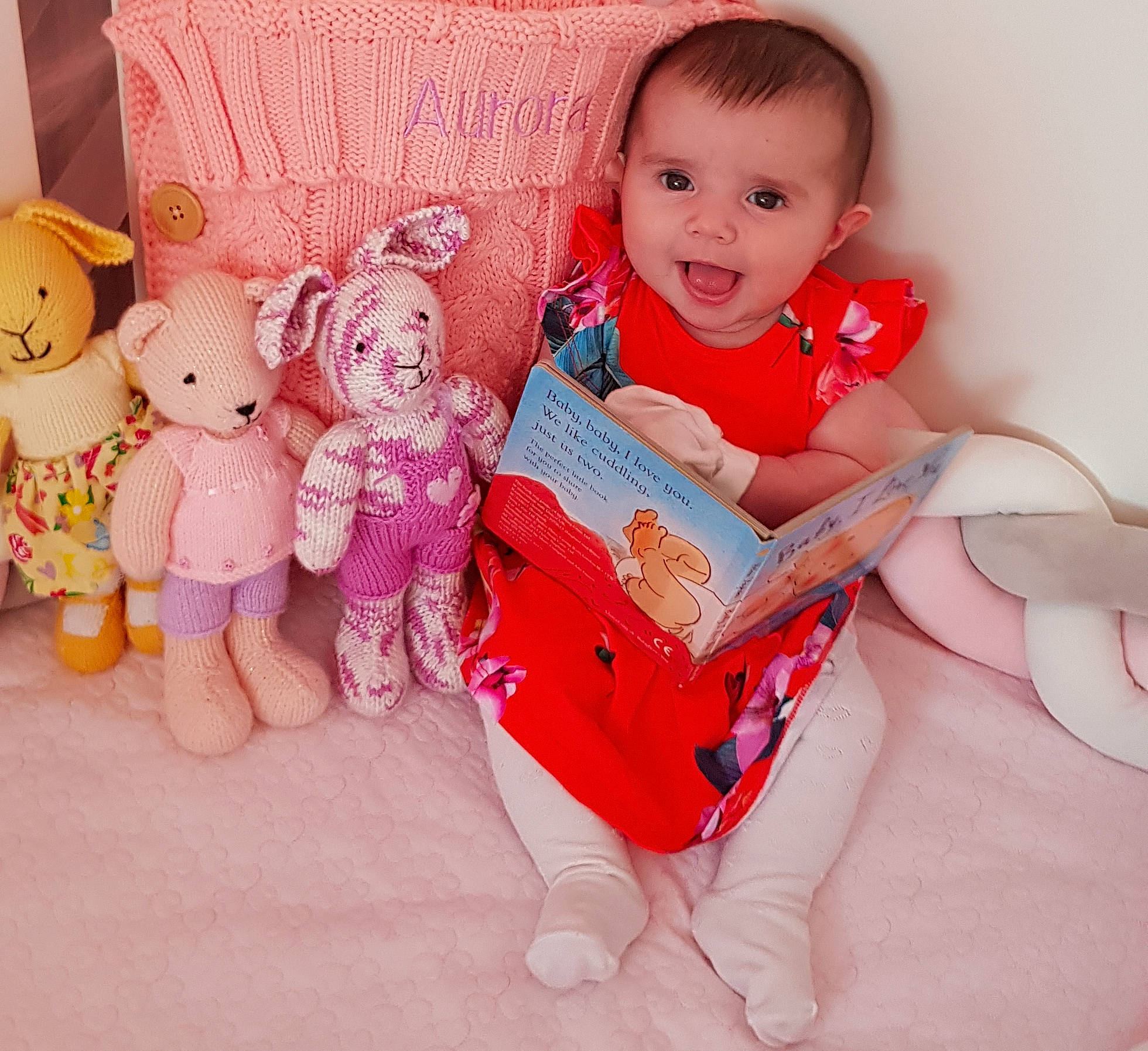 Aurora Clodie is registered to the contest to win money with this photo: baby, baby_toddler_clothing, child, doll, happy, person, pink, play, plush, product, room, sitting, skin, smile, stuffed_toy, textile, toddler, toy