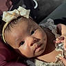 Nevaeh is registered to the contest to win money with this photo: baby, infant, child, headband, bow, cute, portrait, closeup, face, eyes, clothing, floral, soft_lighting, indoor, person, newborn, adorable, skin, expression, young