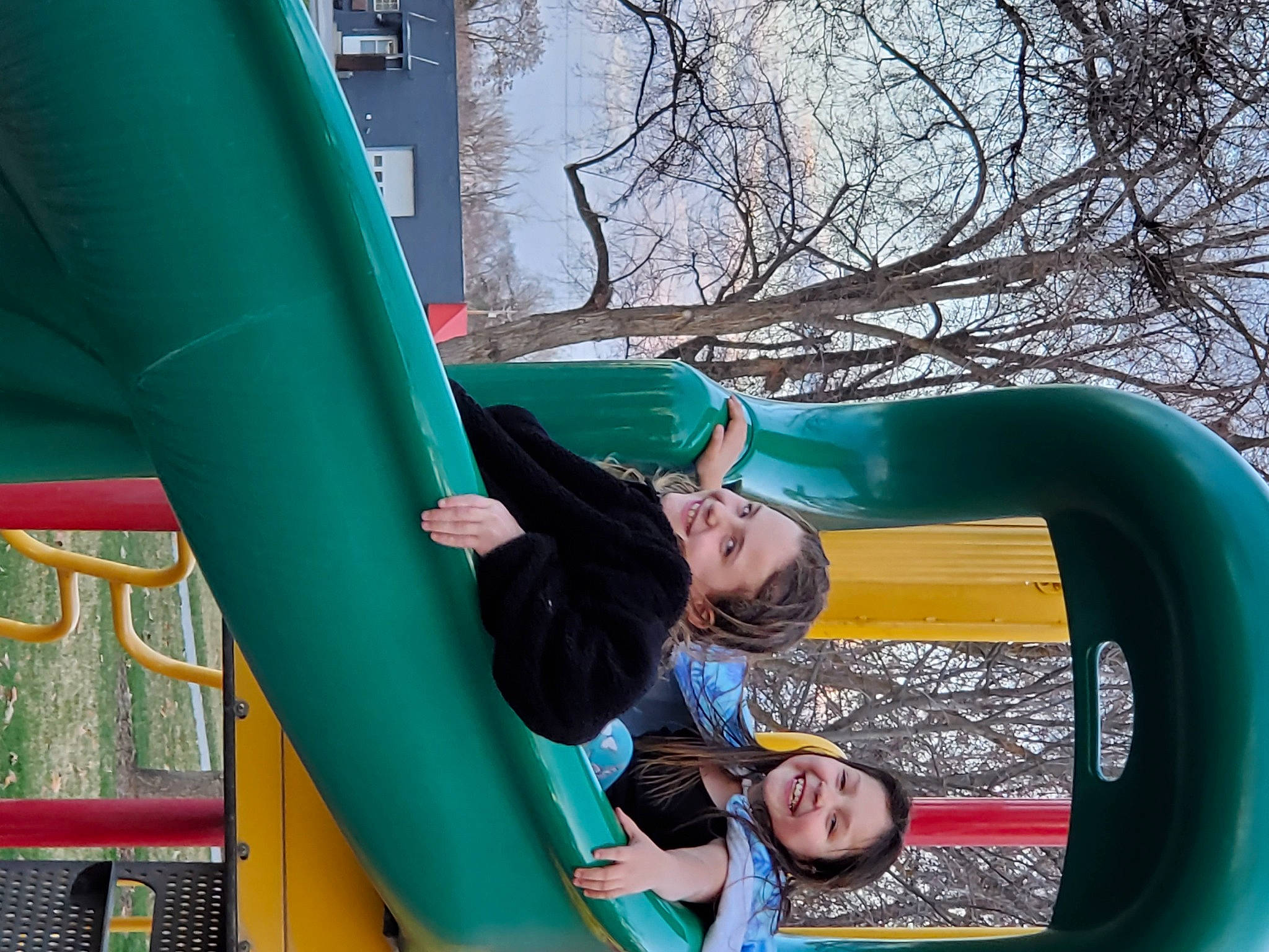 Zoe joined the competition — help win amazing prizes! chute, city, fun, games, green, inflatable, joy, leisure, outdoor_play_equipment, person, play, playground, playground_slide, public_space, recreation, smile, tree