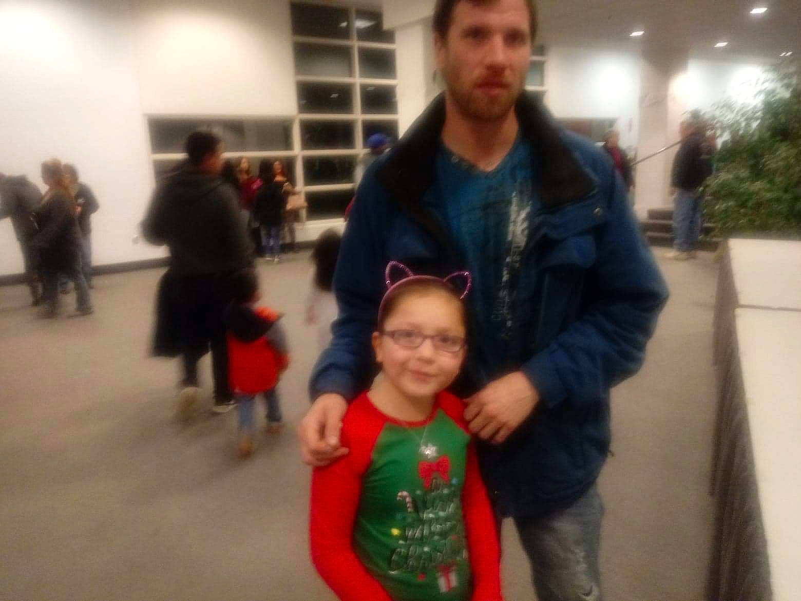 Estrella is registered to the contest to win money with this photo: child, electronic_device, event, family, fun, joy, people, person, smile, standing, style, technology, toddler, vacation