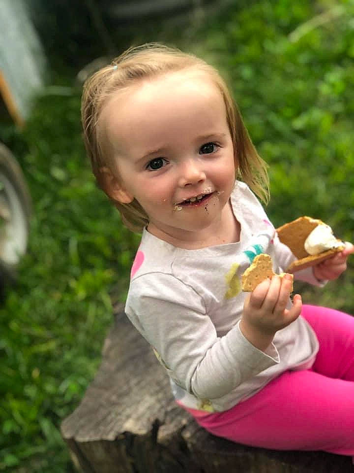 Bri is registered to the contest to win money with this photo: baby, child, eating, fun, grass, joy, person, play, smile, toddler