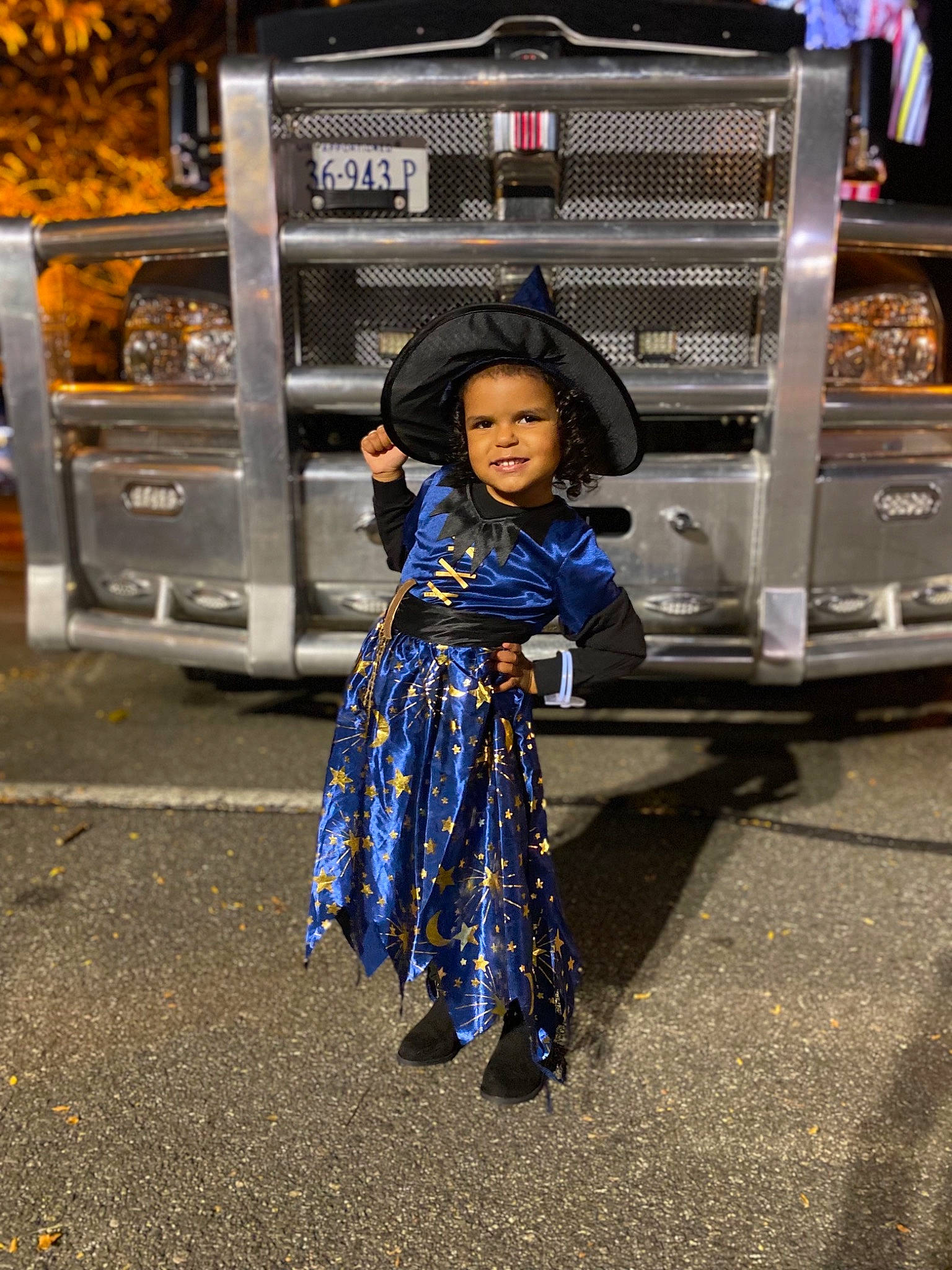 Haidyn is registered to the contest to win money with this photo: asphalt, auto_part, automotive_exterior, automotive_lighting, automotive_tire, automotive_wheel_system, electric_blue, event, happy, hat, headwear, joy, mode_of_transport, motor_vehicle, person, public_space, road, smile, street, street_fashion