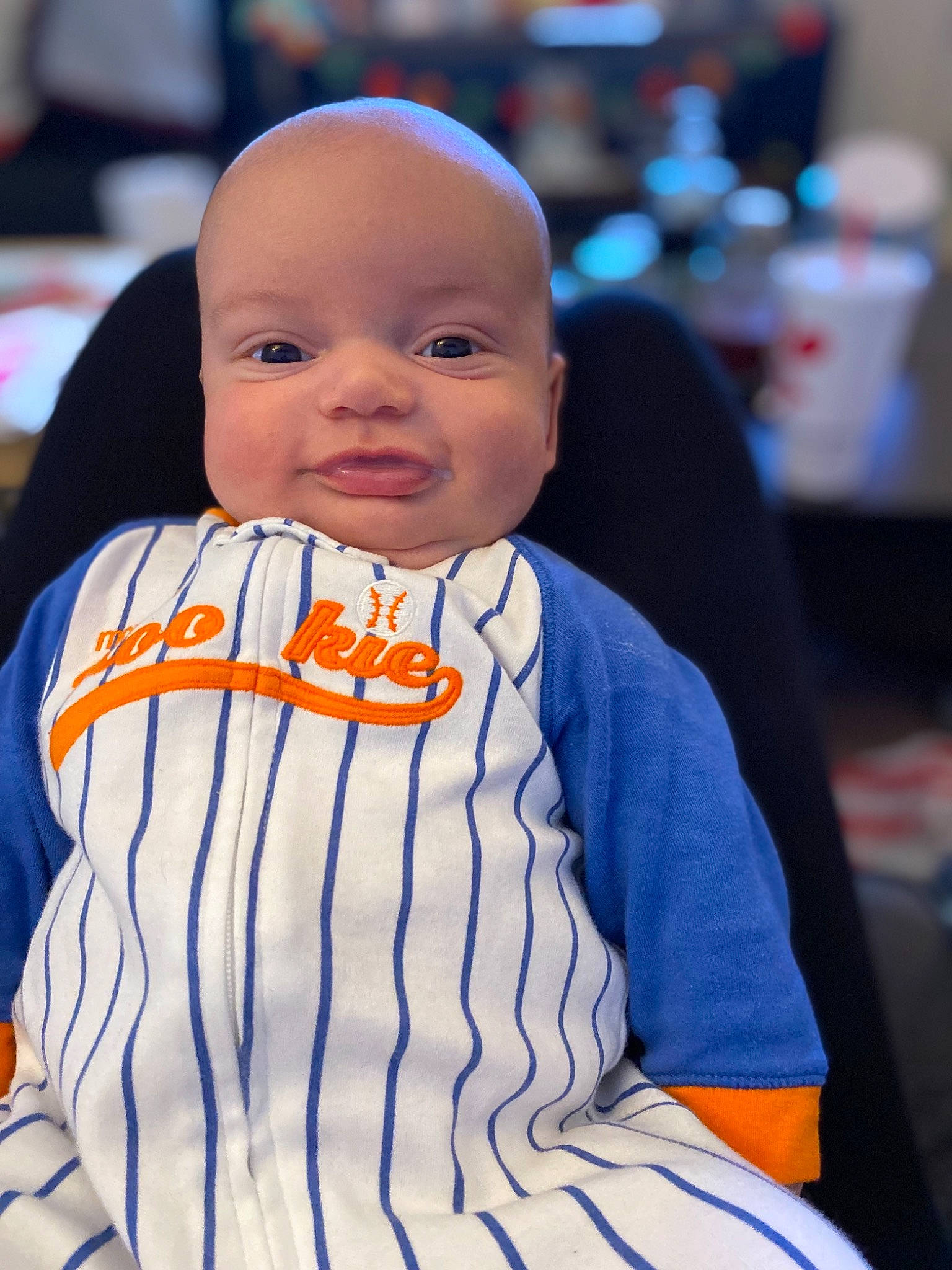 Fletcher is registered to the contest to win money with this photo: baby, baby_toddler_clothing, cheek, child, electric_blue, event, facial_expression, fashion_accessory, formal_wear, fun, happy, person, sitting, skin, sleeve, smile, standing, street_fashion, t_shirt, toddler