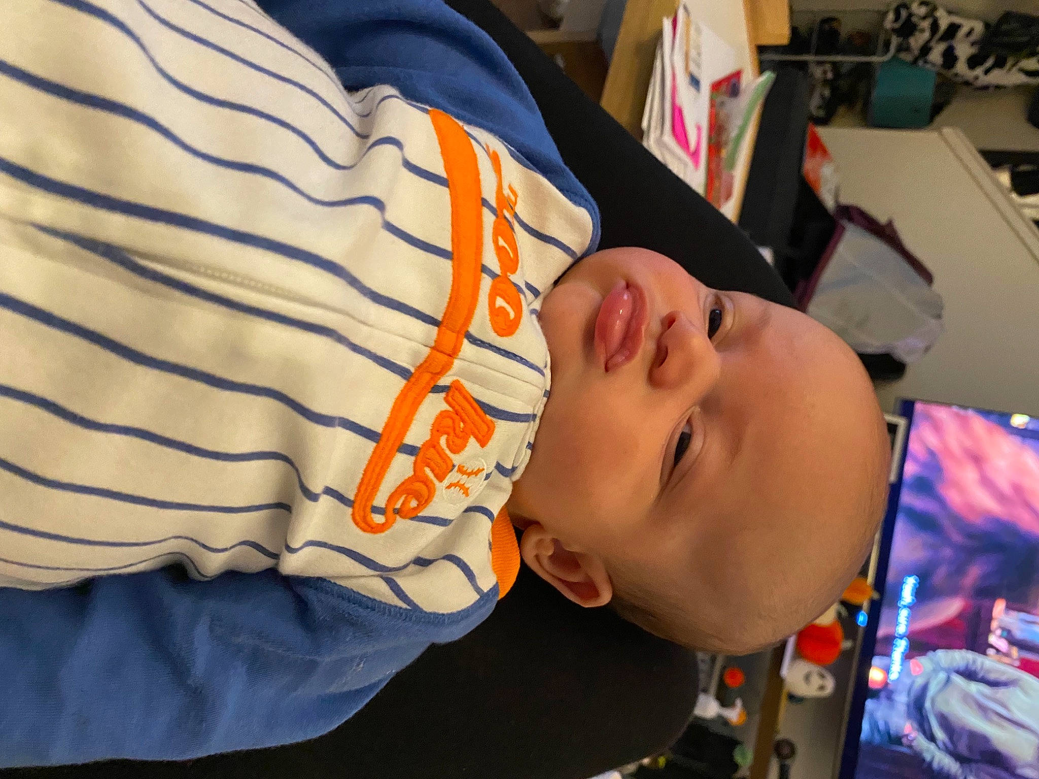 Fletcher is registered to the contest to win money with this photo: automotive_design, baby, child, eyewear, fun, headgear, pattern, person, personal_protective_equipment, sleeve, t_shirt, toddler, vacation