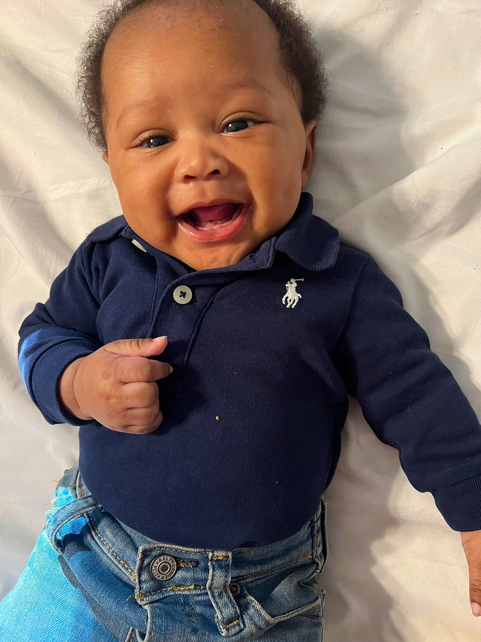 Alex is registered to the contest to win money with this photo: arm, baby, baby_toddler_clothing, cheek, chin, collar, cool, dress_shirt, finger, gesture, happy, iris, neck, nose, outerwear, person, skin, sleeve, smile, thumb