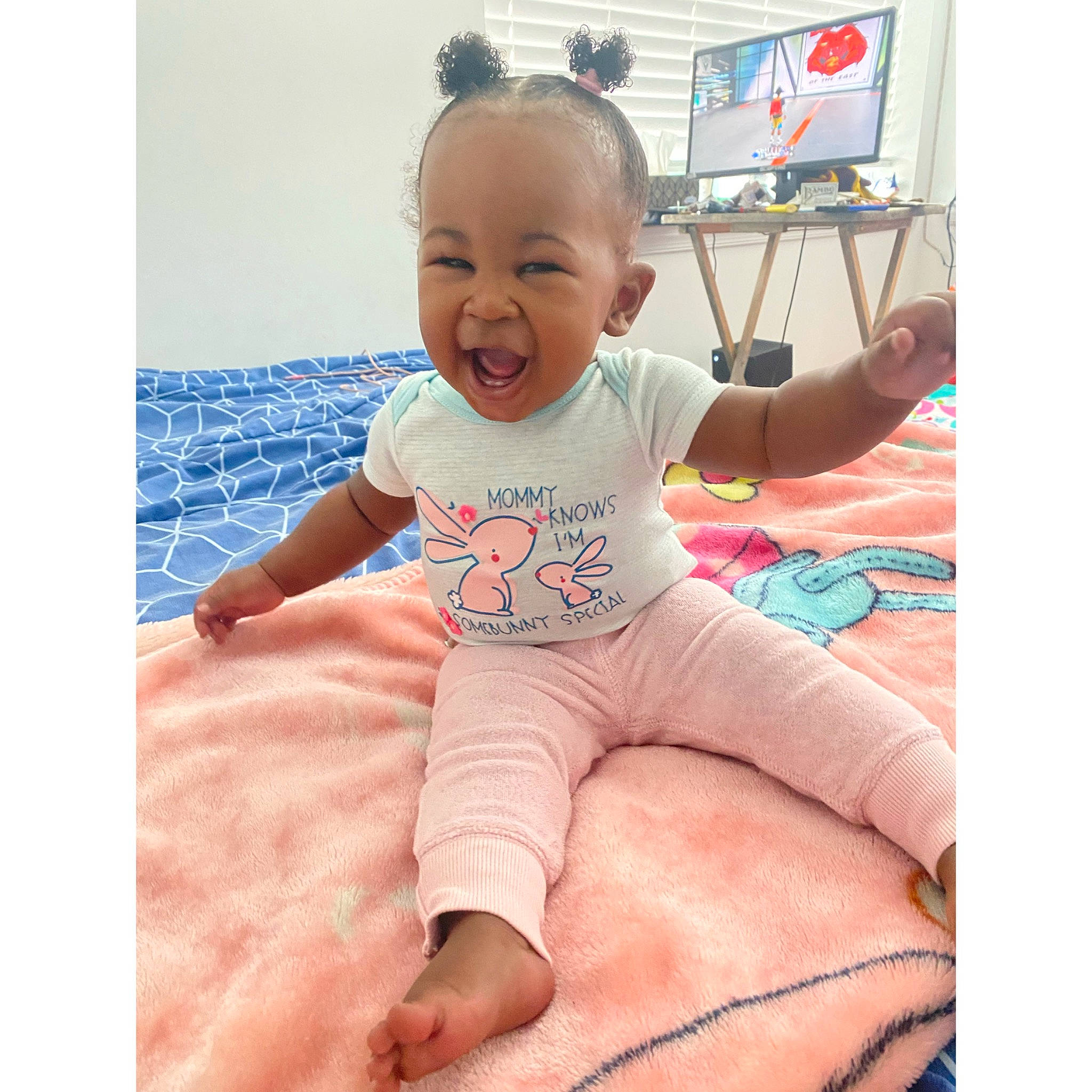 Asiyah joined the competition — help win amazing prizes! arm, baby, baby_toddler_clothing, comfort, face, finger, foot, happy, head, human_body, knee, magenta, pattern, person, pink, sleeve, smile, t_shirt, thigh, thumb