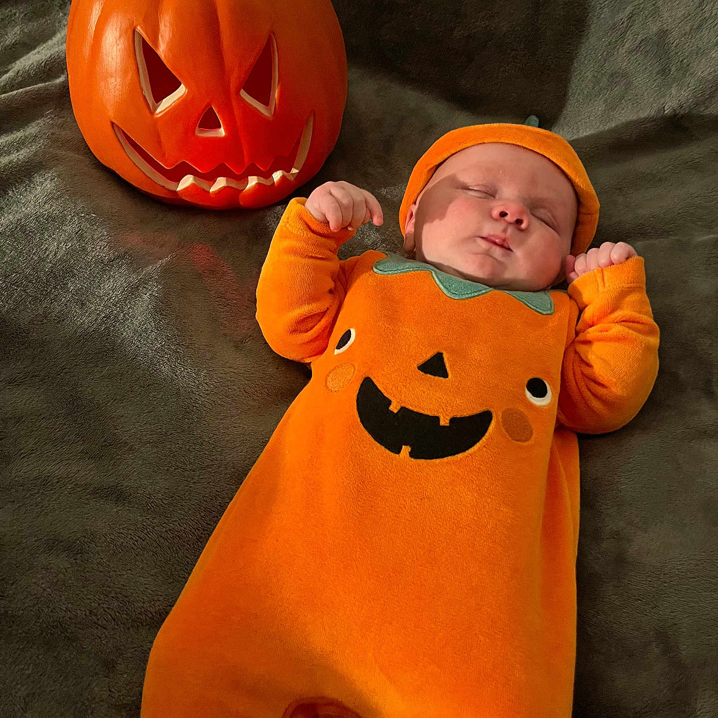Valentino is registered to the contest to win money with this photo: baby, bodypart, clothing, face, festival, finger, food, halloween, hand, hat, head, newborn, person, photography, plant, portrait, produce, pumpkin, squash, vegetable