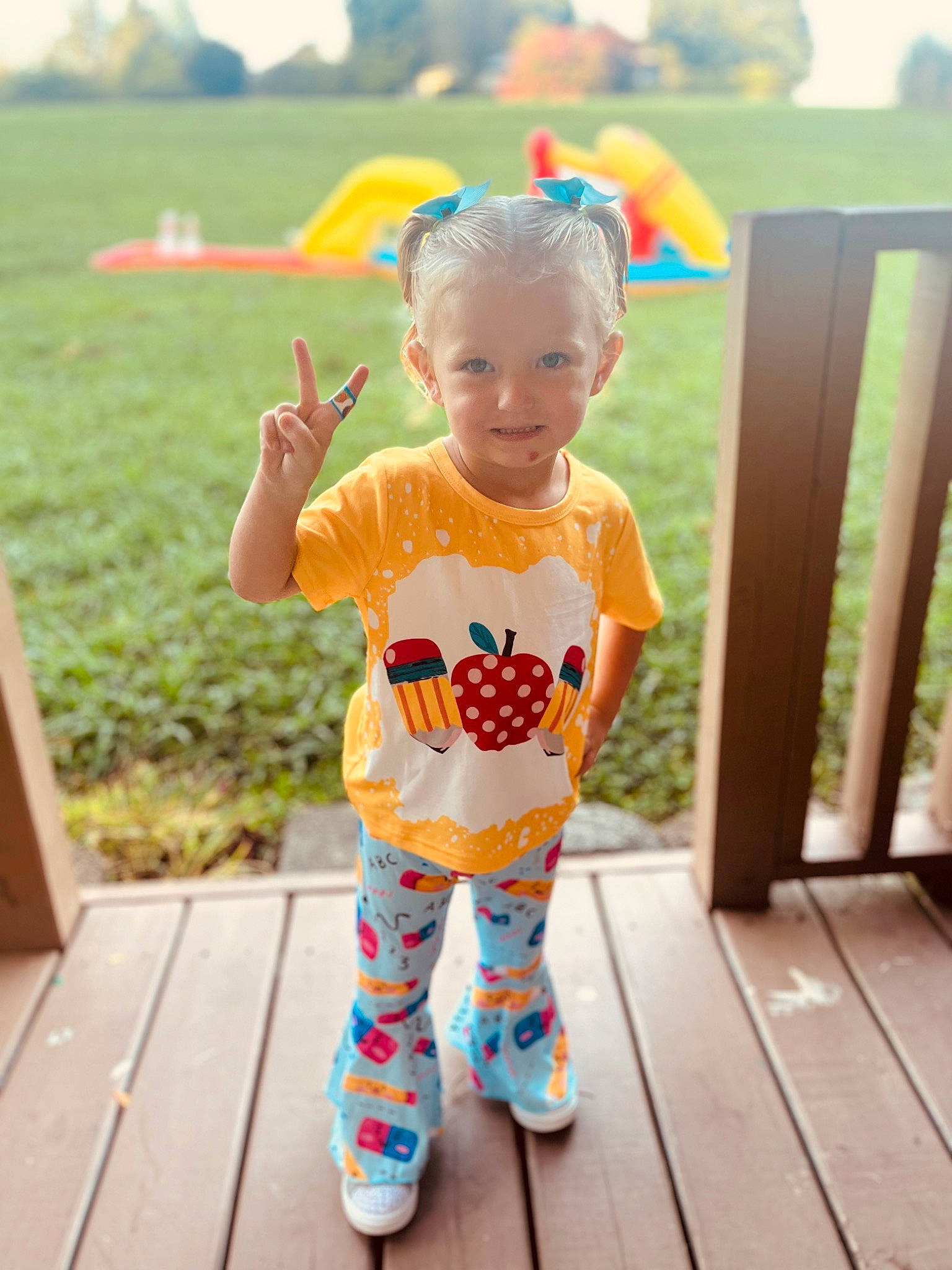 Tatum is registered to the contest to win money with this photo: baby, baby_toddler_clothing, child, clothing, face, fun, grass, happy, hat, joy, leisure, orange, pattern, people_in_nature, person, recreation, sleeve, smile, t_shirt, toddler