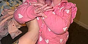 Marlee is registered to the contest to win money with this photo: accessories, baby, bracelet, cap, clothing, costume, face, hat, head, homedecor, indoors, jewelry, pajamas, person, photography, plant, portrait, pottedplant, skin, tattoo