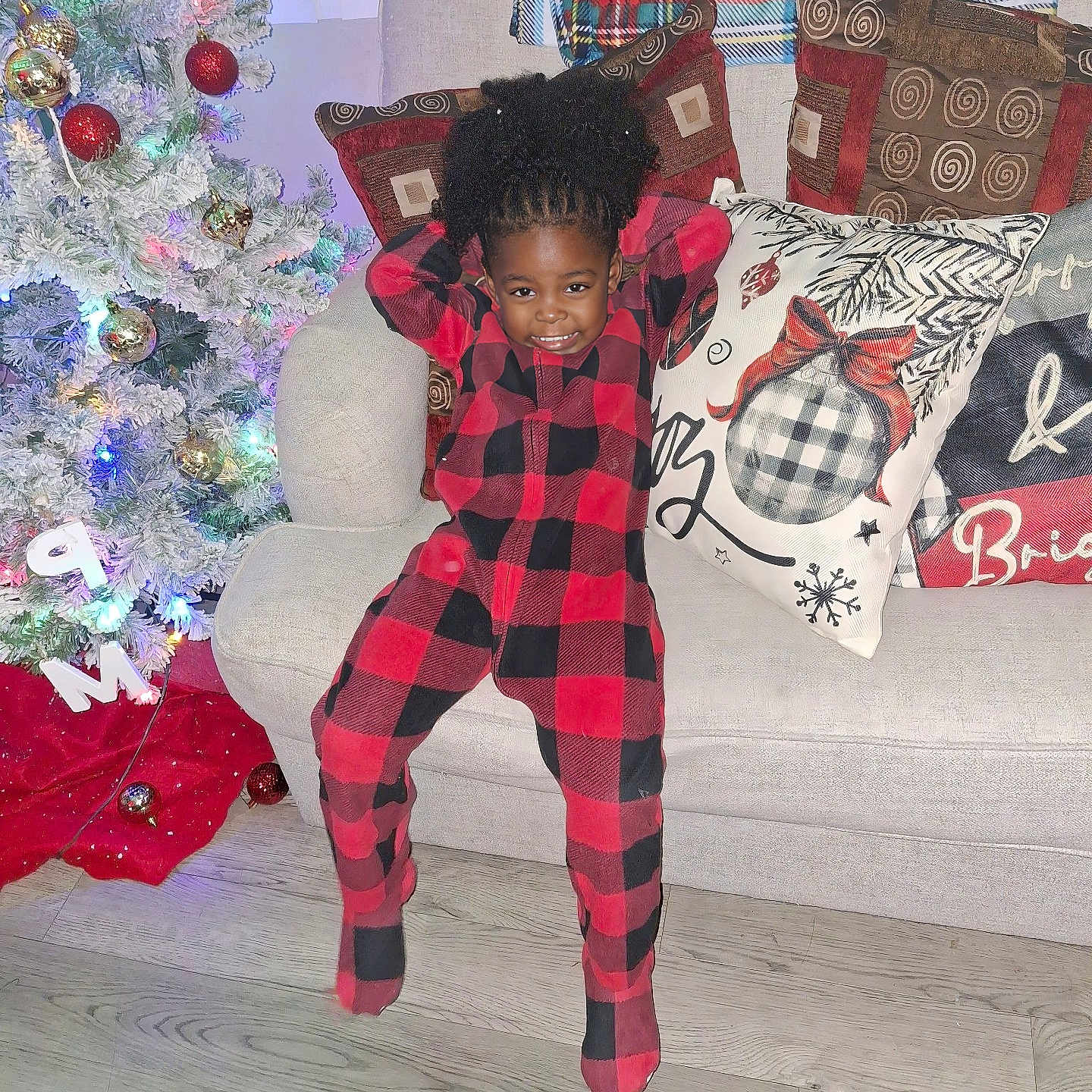 Nevaeh is registered to the contest to win money with this photo: architecture, building, clothing, couch, curlyhair, cushion, face, festival, furniture, hair, head, homedecor, indoors, livingroom, pajamas, pants, person, photography, portrait, room