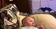 Forrestt joined the competition — help win amazing prizes! baby, infant, blanket, pillow, couch, indoor, room, furniture, stuffed_animal, toy, clothing, person, relaxing, home, soft, cozy, curious, sitting, decor, casual