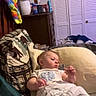 baby, blanket, casual, clothing, couch, cozy, curious, decor, furniture, home, indoor, infant, person, pillow, relaxing, room, sitting, soft, stuffed_animal, toy