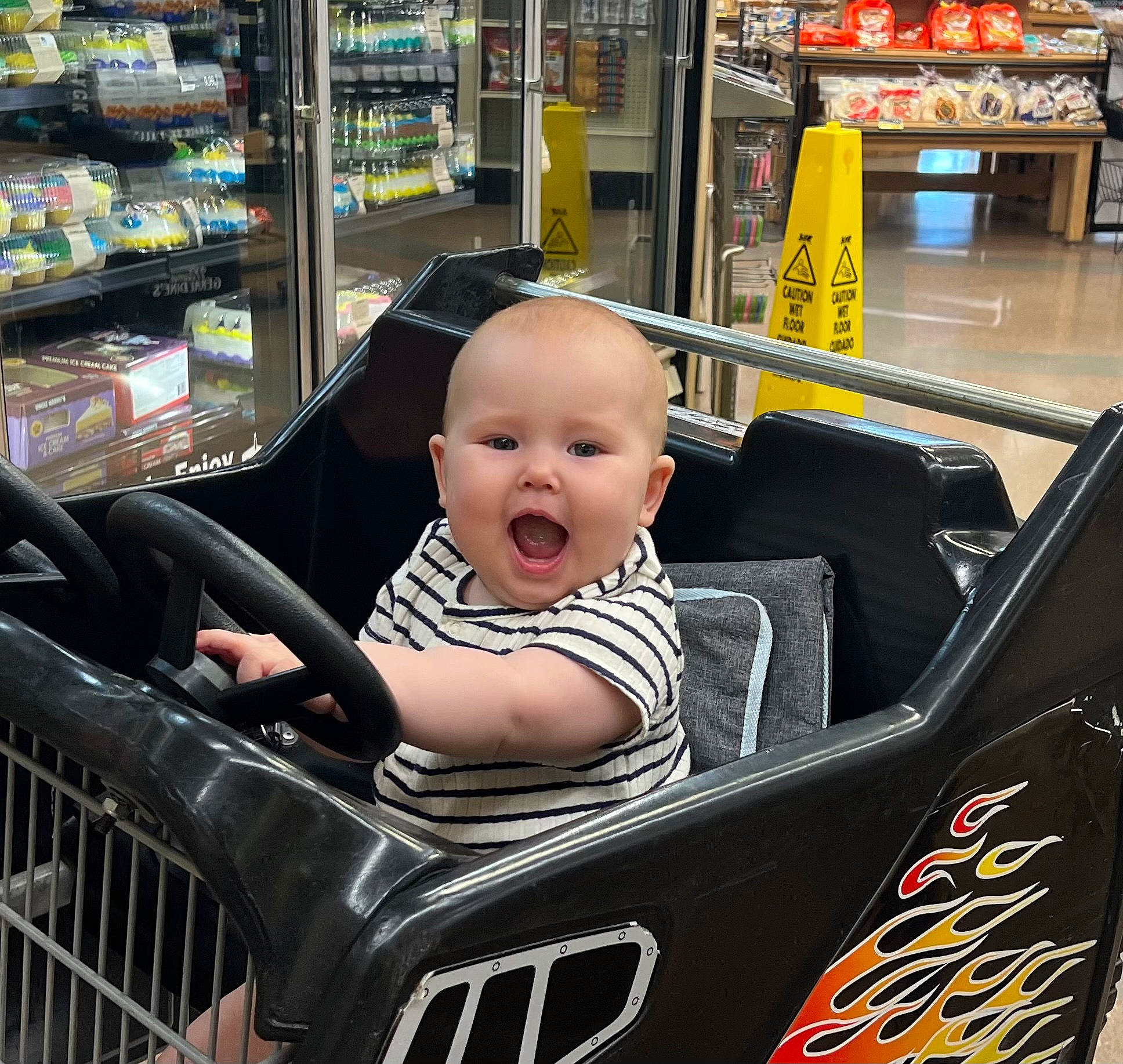 Gwen joined the competition — help win amazing prizes! automotive_design, automotive_exterior, automotive_tire, baby, baby_toddler_clothing, black, convenience_store, customer, fun, motor_vehicle, person, photograph, product, shelf, shopping_cart, smile, snapshot, tire, toddler, vehicle