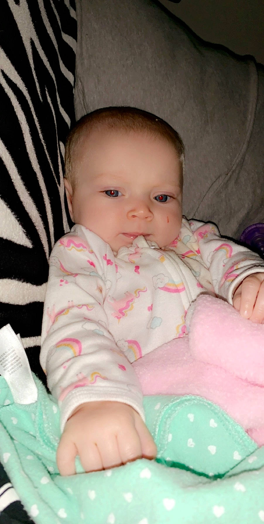 Harlee is registered to the contest to win money with this photo: baby, baby_products, baby_toddler_clothing, cheek, child, eye, face, finger, iris, lip, mouth, nose, person, pink, product, sitting, skin, toddler