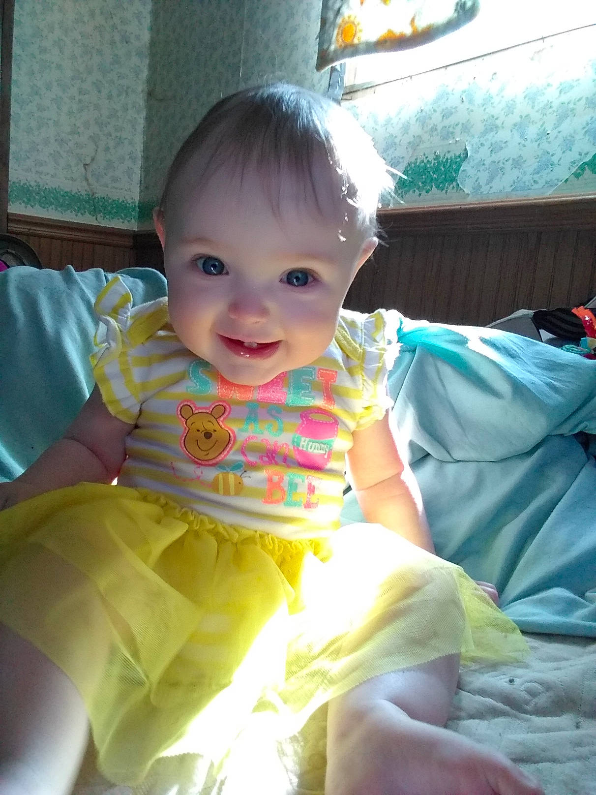 Sahara is registered to the contest to win money with this photo: baby, beauty, cheek, child, daughter, face, head, joy, person, play, sitting, skin, smile, toddler