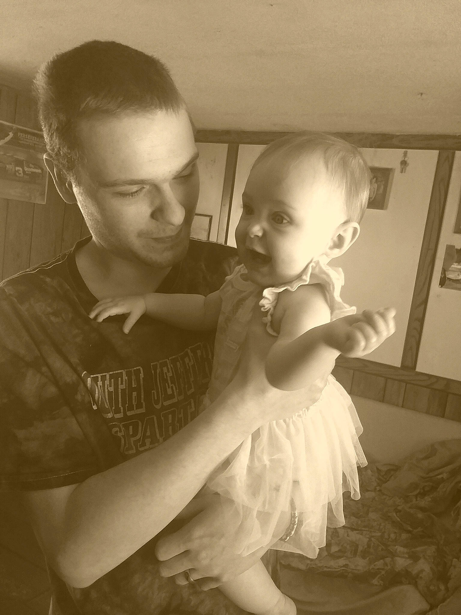 Sahara is registered to the contest to win money with this photo: black_and_white, child, costume, dress, fun, hairstyle, happy, hug, monochrome, monochrome_photography, mother, person, photograph, photography, smile, snapshot, standing, stock_photography, style, toddler