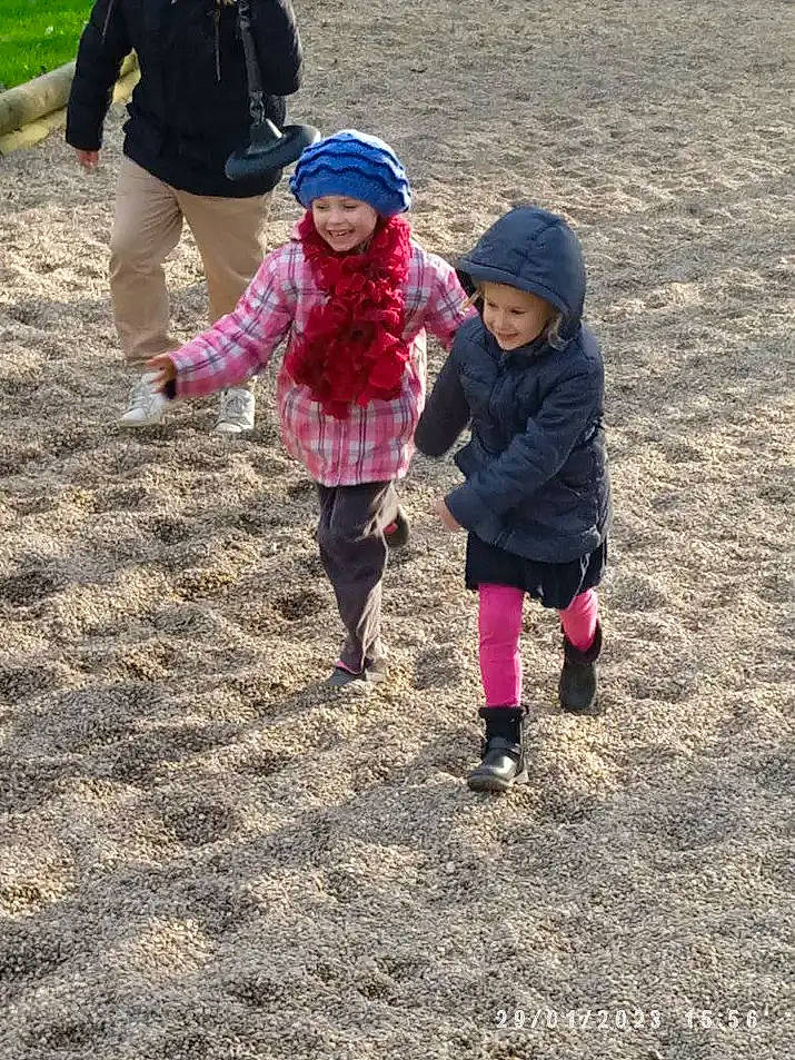 Anita participe au concours pour gagner de l'argent avec cette photo : boot, child, clothing, fun, gesture, grass, hat, headwear, jacket, joy, landscape, leisure, magenta, people_in_nature, person, plant, play, recreation, sand, soil