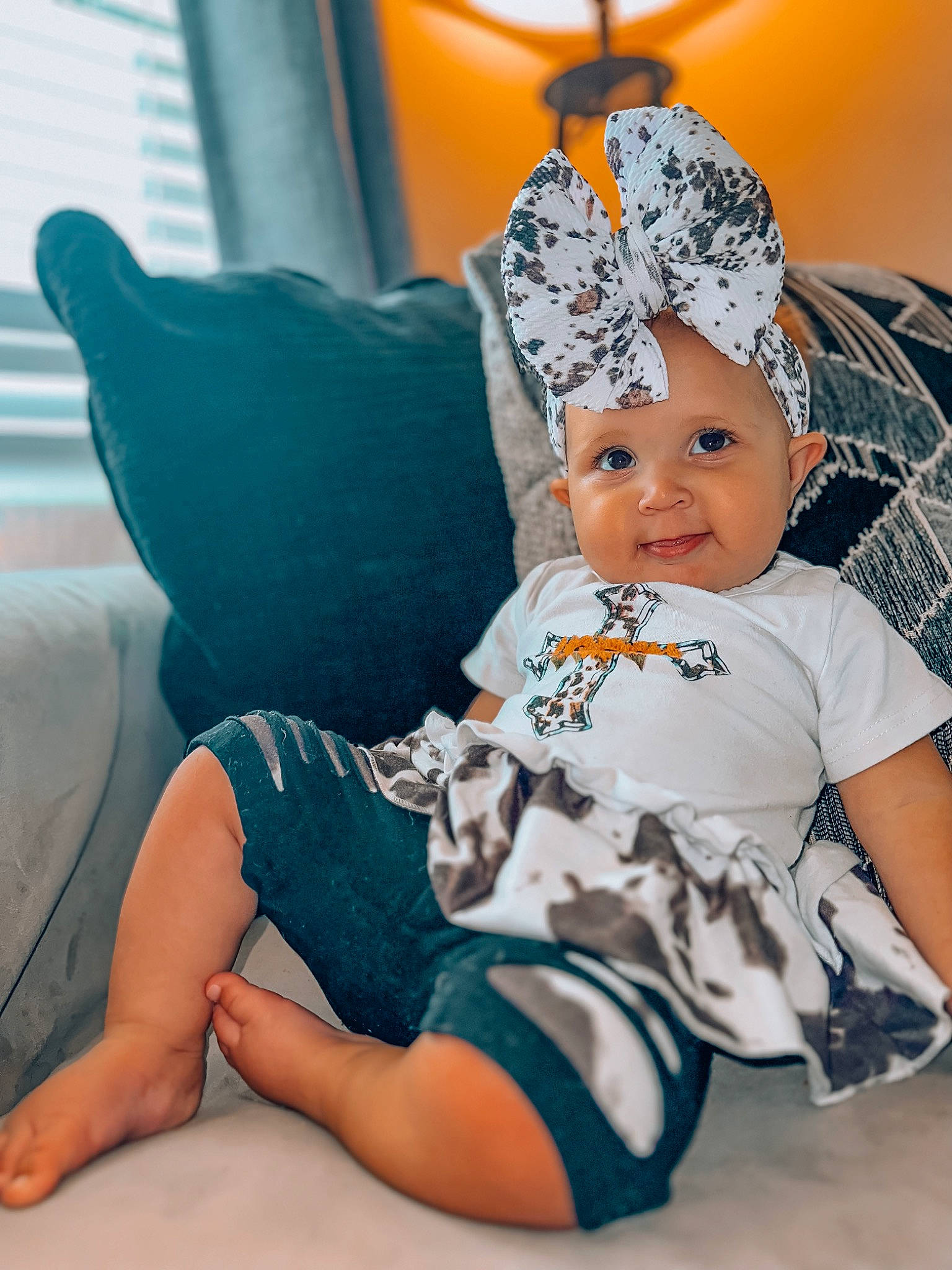 Adelaine joined the competition — help win amazing prizes! abdomen, baby, baby_toddler_clothing, cap, child, comfort, eye, fashion_accessory, foot, fun, happy, headgear, headwear, human_leg, knee, leg, person, sitting, sleeve, t_shirt