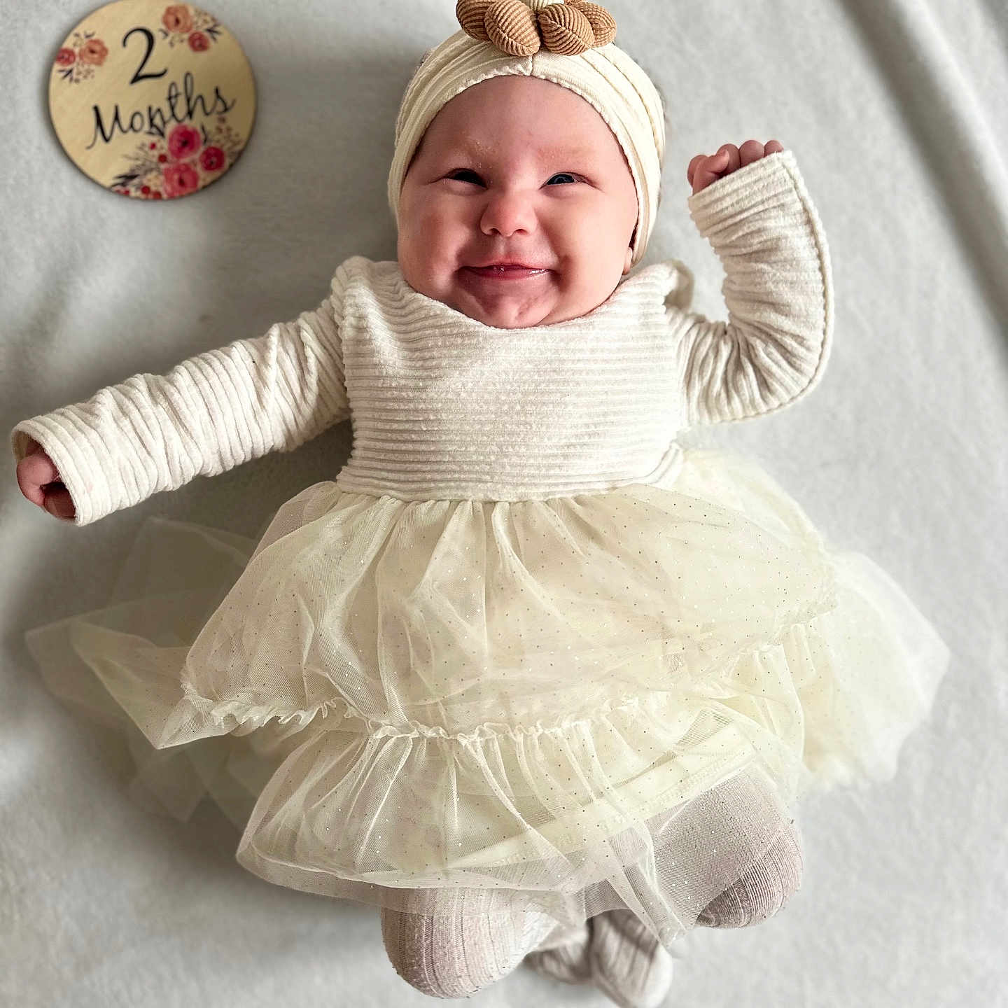 Lya a rejoint le concours — aidez-le/la à gagner de superbes lots ! accessories, baby, bonnet, cap, clothing, costume, dress, face, glove, happy, hat, head, jewelry, necklace, newborn, pants, person, photography, portrait, sitting
