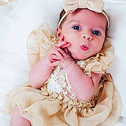 Inès participe au concours pour gagner de l'argent avec cette photo : baby, infant, child, dress, bow, headband, pillow, cute, hands, face, skin, expression, lying, soft, white, lace, fabric, closeup, newborn, adorable