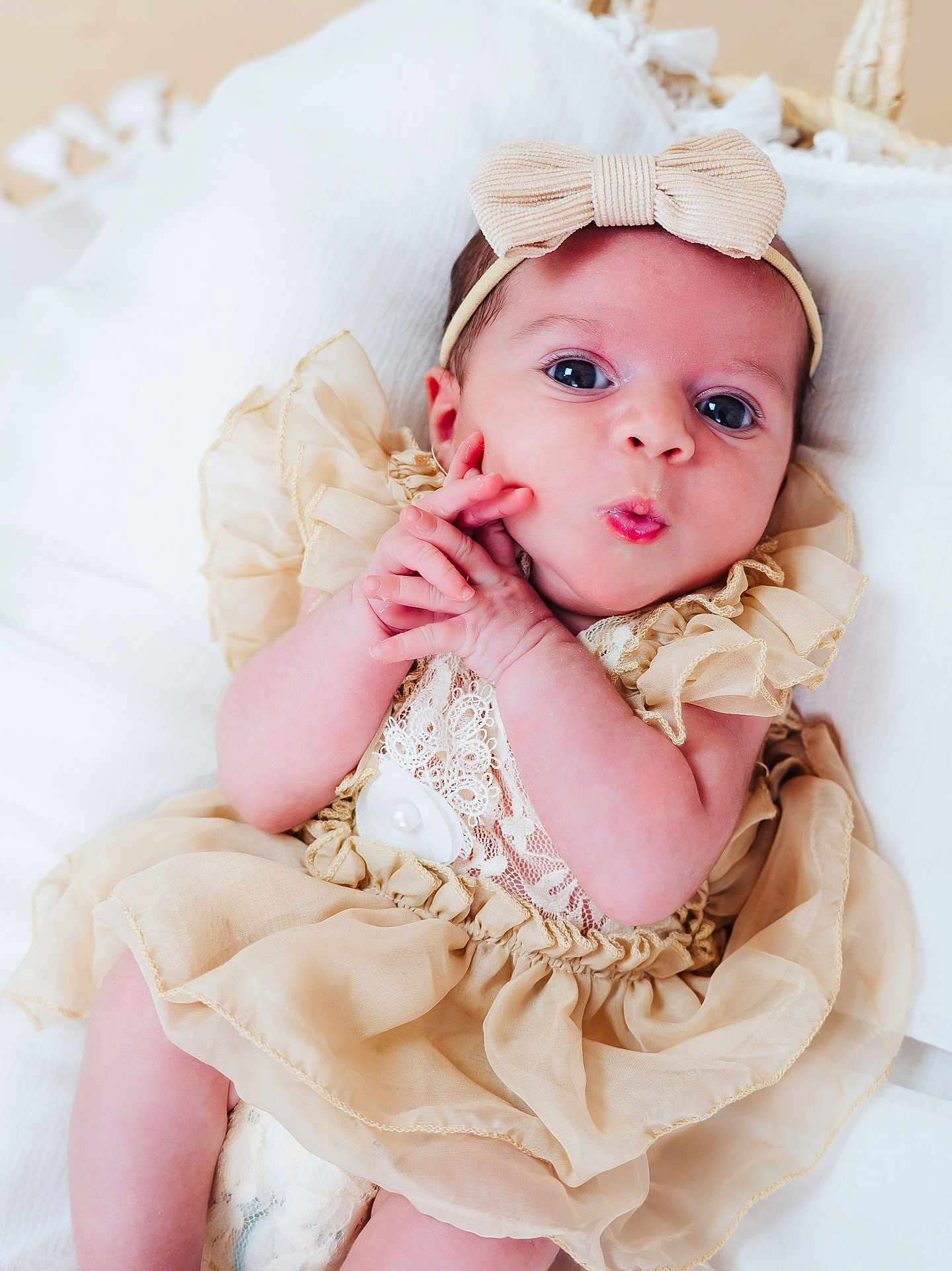 Inès participe au concours pour gagner de l'argent avec cette photo : baby, infant, child, dress, bow, headband, pillow, cute, hands, face, skin, expression, lying, soft, white, lace, fabric, closeup, newborn, adorable