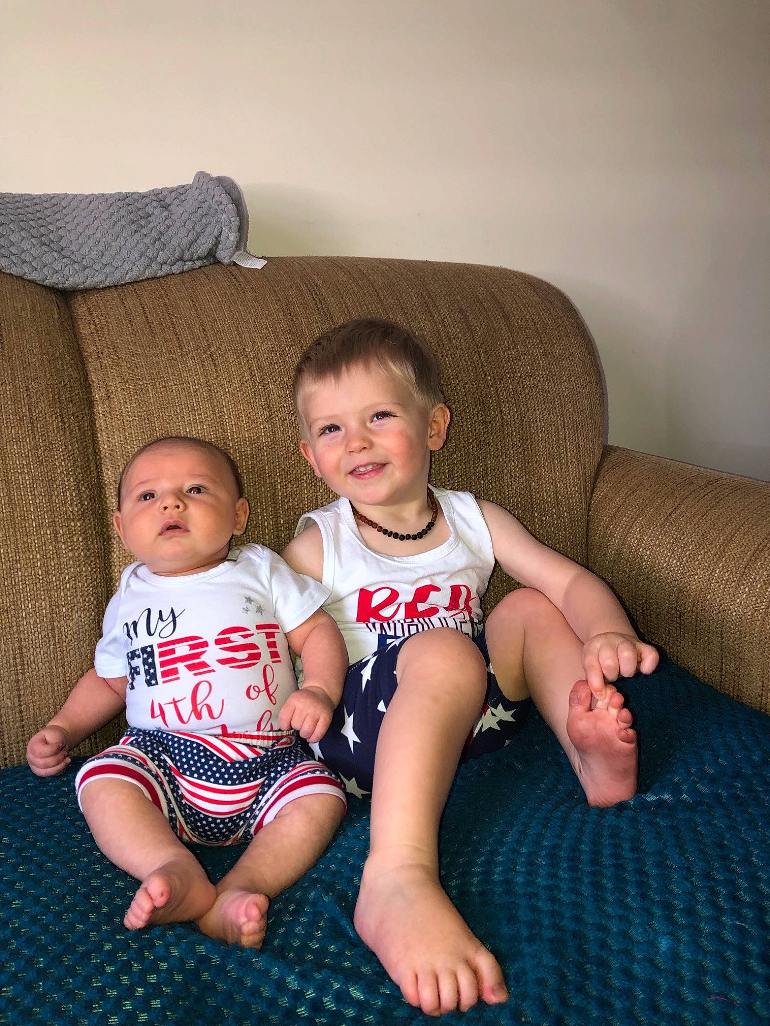 Mac joined the competition — help win amazing prizes! baby, barefoot, cheek, child, cousin, daughter, face, family, fun, head, iris, joy, lap, leg, people, person, sibling, sitting, skin, smile