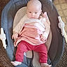 Lainey is registered to the contest to win money with this photo: baby, infant, baby_rocker, red_pants, pink_top, clothing, face, person, indoor, carpet, seat, baby_seat, child, cute, young, home, floor, comfort, resting, curious