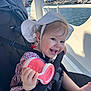 baby, child, smiling, hat, stroller, sippy_cup, waterfront, boats, sunlight, outdoor, happy, cute, summer, clothing, person, foot, hand, earrings, seatbelt, nature