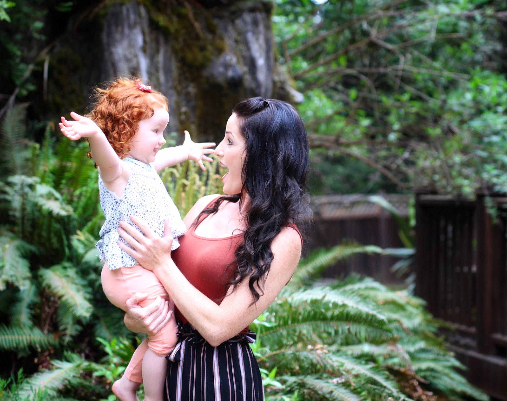 Evalynn is registered to the contest to win money with this photo: botany, child, dress, fawn, forest, fun, hug, joy, jungle, leaf, people_in_nature, person, photo_shoot, photograph, photography, plant, rainforest, smile, tree, woodland