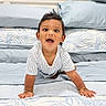 baby, child, crawling, smiling, happy, portrait, bed, bedroom, pillows, blanket, bedding, indoors, infant, face, eyes, open_mouth, striped_shirt, hands, 床, photography