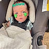 Zane joined the competition — help win amazing prizes! baby, infant, child, car_seat, carriage, buckled, blanket, wrapped, portrait, face, eyes_open, serious_expression, dinosaur_stickers, text_overlay, indoor, seated, safety_harness, pacifier, cozy, photograph