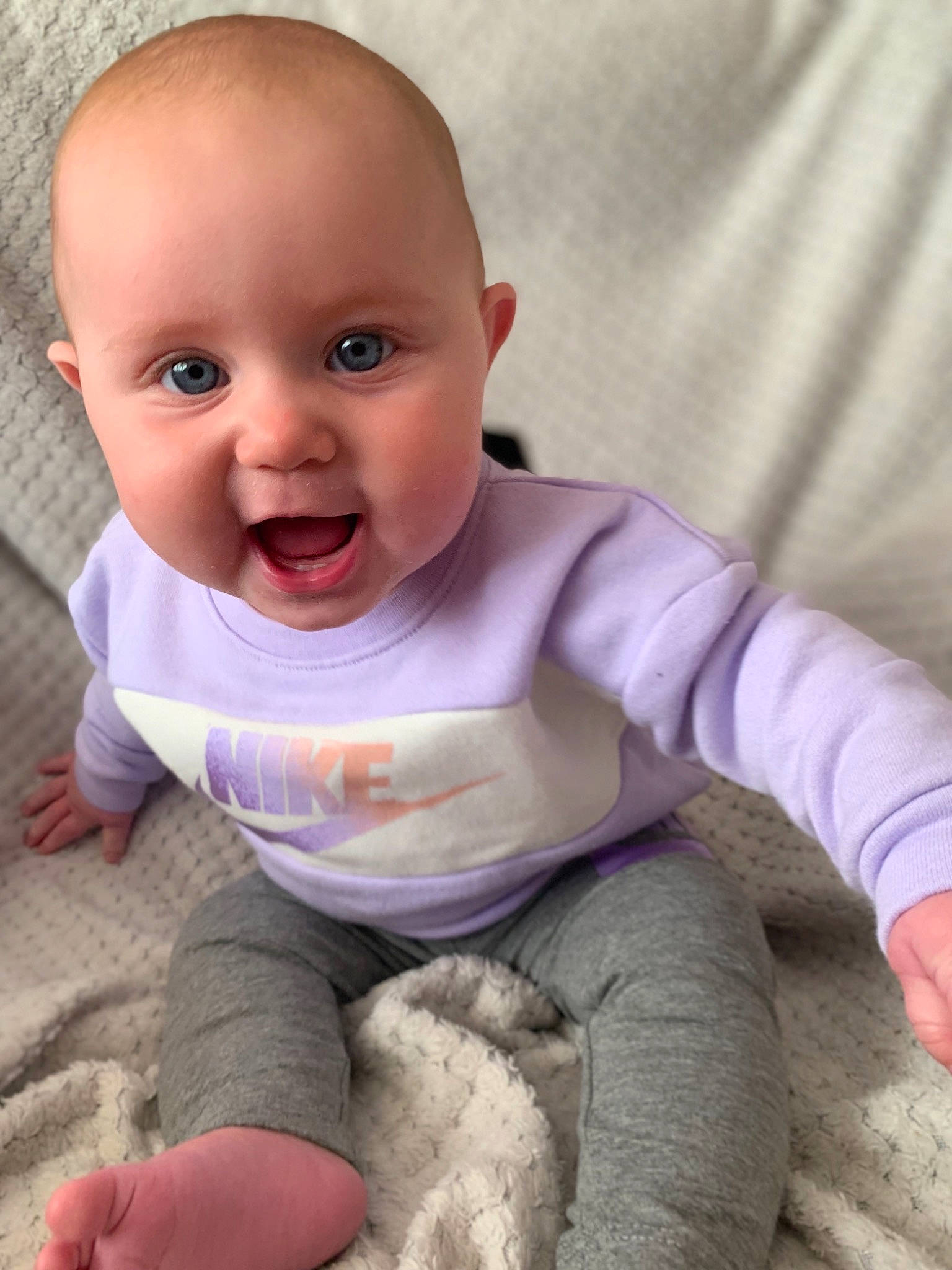 Savannah-rose is registered to the contest to win money with this photo: baby, baby_making_funny_faces, cheek, child, eye, face, facial_expression, finger, hand, head, lip, mouth, nose, person, sitting, skin, sleeve, smile, toddler, tummy_time