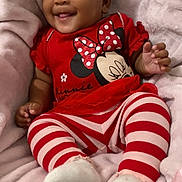 Jermani Brown joined the competition — help win amazing prizes! baby, infant, smiling, red_clothing, striped_leggings, minnie_mouse, cute, child, soft_blanket, cozy, happy, portrait, toddler, playful, socks, indoors, young_child, comfortable, resting, adorable