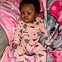 baby, babylaughing, blanket, clothing, face, hair, happy, head, pajamas, person, smile