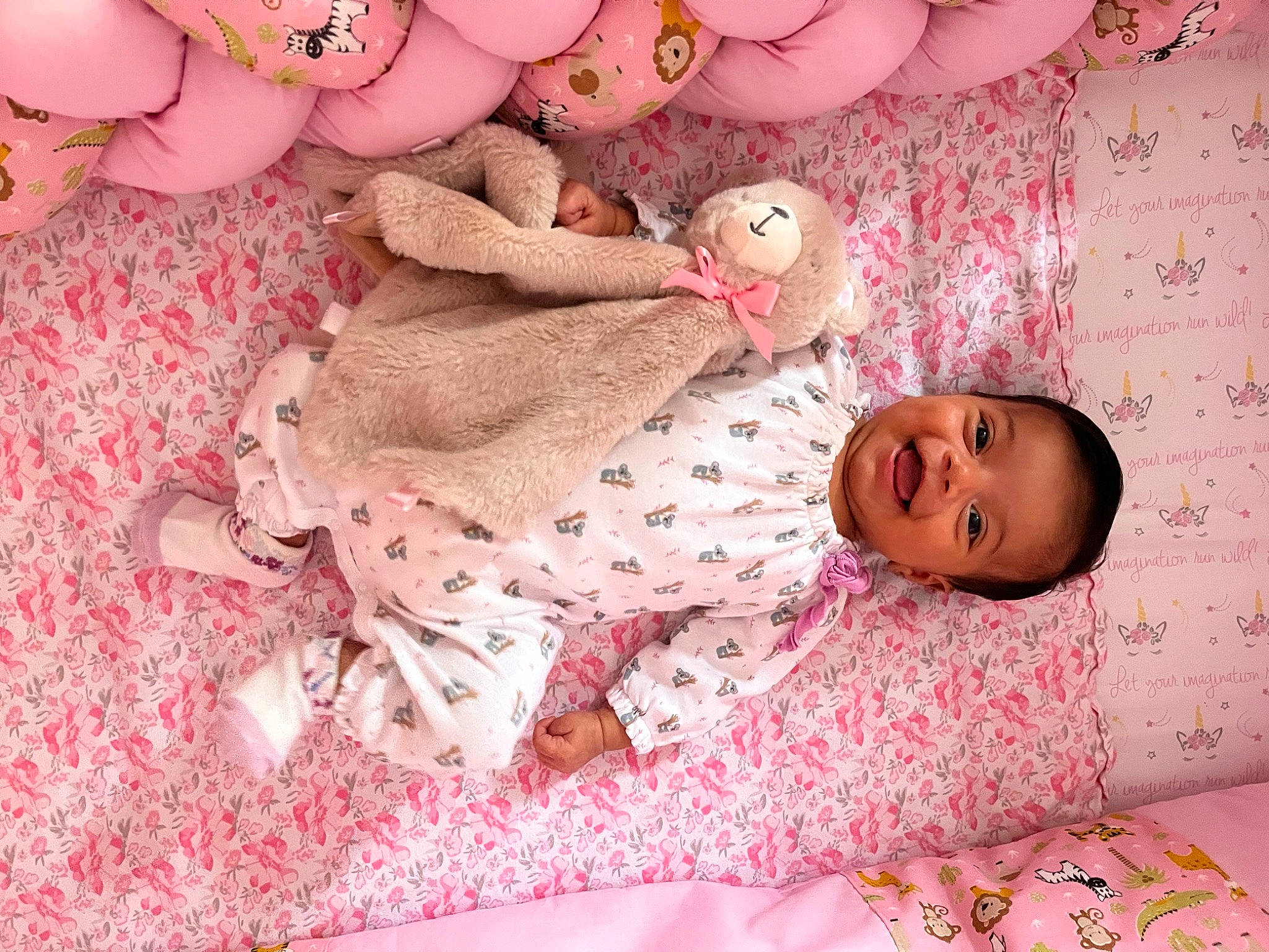 Elizabeth is registered to the contest to win money with this photo: baby, baby_products, baby_toddler_clothing, bed, bed_sheet, bedding, bedtime, child, comfort, joy, linens, magenta, pattern, person, pink, room, skin, stuffed_toy, textile, toddler