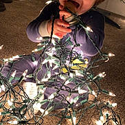 Trysten joined the competition — help win amazing prizes! toddler, child, christmas_lights, indoor, carpet, holiday, playful, smiling, holiday_decor, festive, lights, tree, young_child, candid, cute, messy, fun, curious, nighttime, warm_lighting