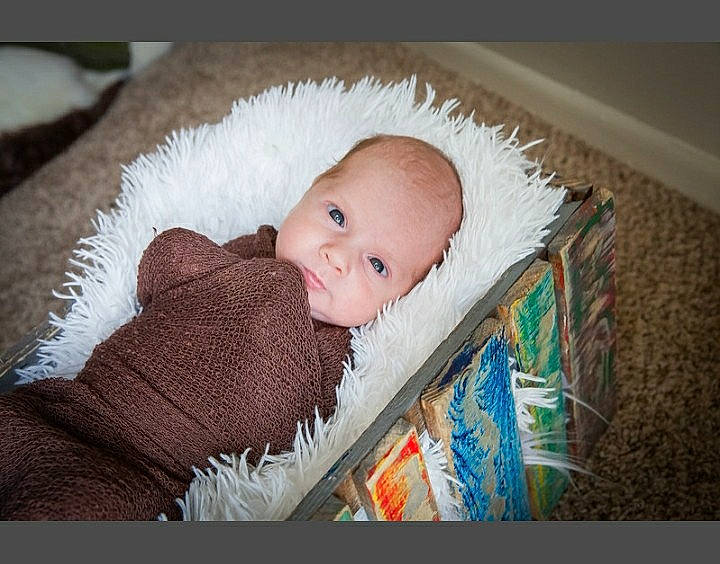 Austin is registered to the contest to win money with this photo: baby, baby_products, baby_toddler_clothing, cheek, child, comfort, fur, happy, iris, linens, person, portrait_photography, room, sitting, skin, smile, textile, toddler, wood, wool