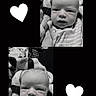 baby, infant, black_and_white, portrait, striped_clothing, blanket, heart_graphics, cute, cozy, expression, face, newborn, soft_texture, sleepwear, child, monochrome, closeup, person, adorable, resting