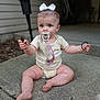 baby, child, pacifier, bow, onesie, sitting, outdoor, concrete, pavement, barefoot, hands, eyes, expression, toy, pacifier_clip, hair, legs, face, portrait, holding_stick